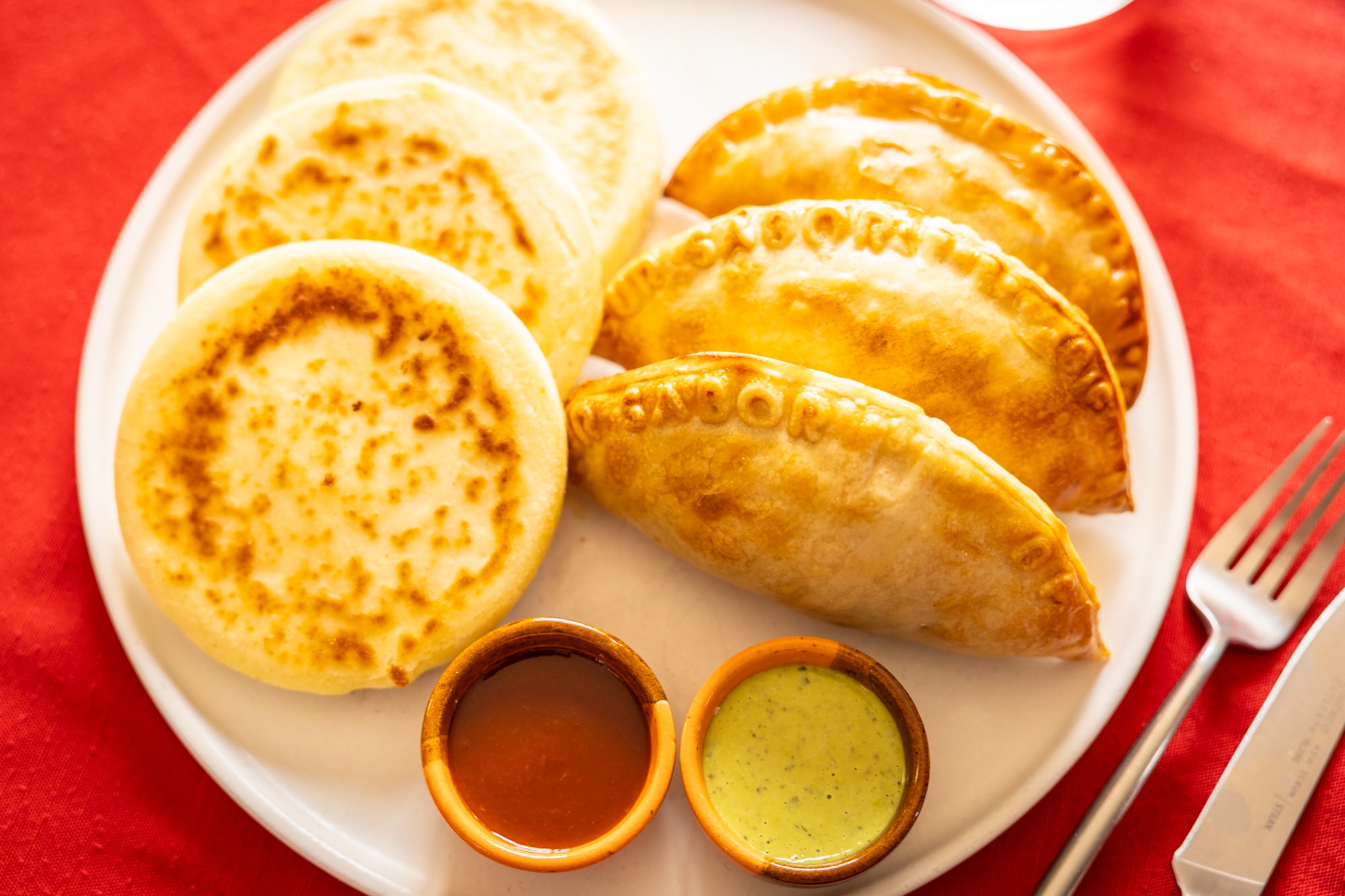 Empanada with arepa bun